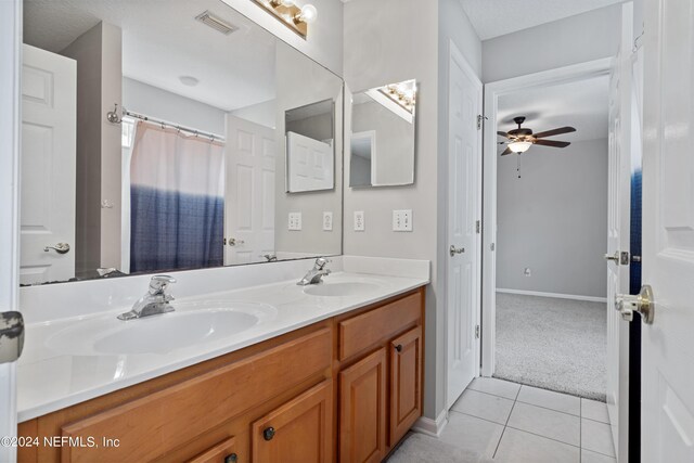 bathroom featuring vanity, ceiling fan, and tile patterned floors