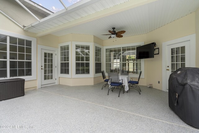 view of patio / terrace featuring ceiling fan and a grill