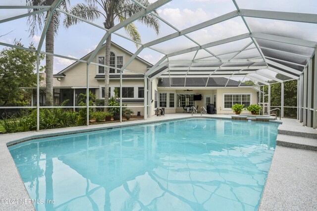 view of pool featuring a lanai and a patio area