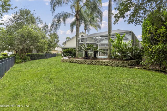 view of yard with a lanai