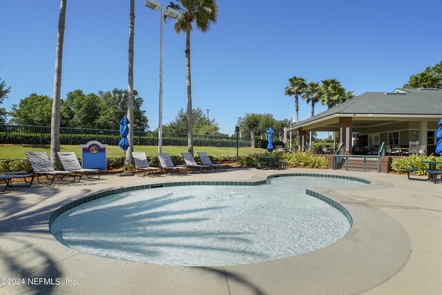 view of swimming pool featuring a patio