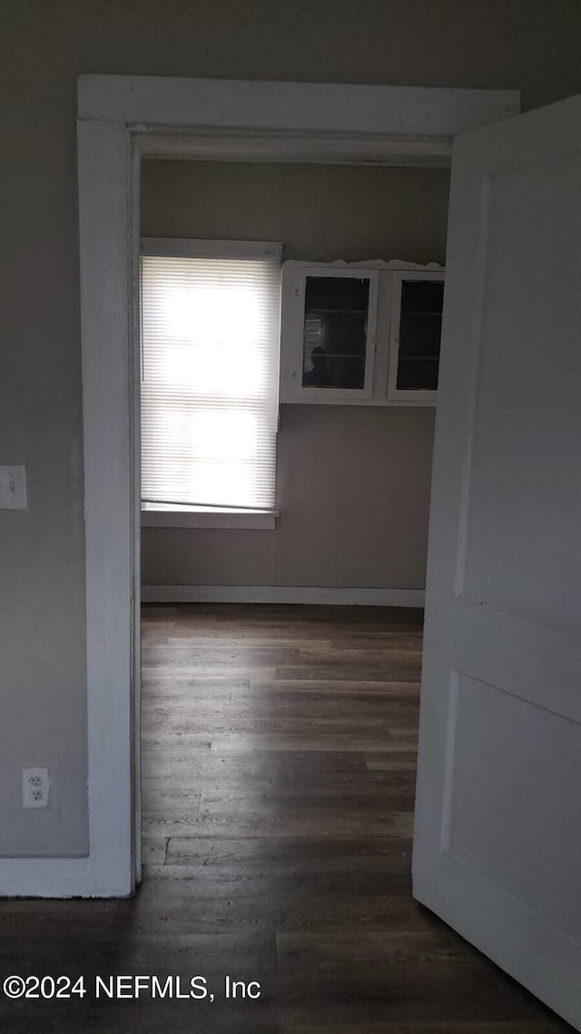 spare room featuring dark hardwood / wood-style flooring