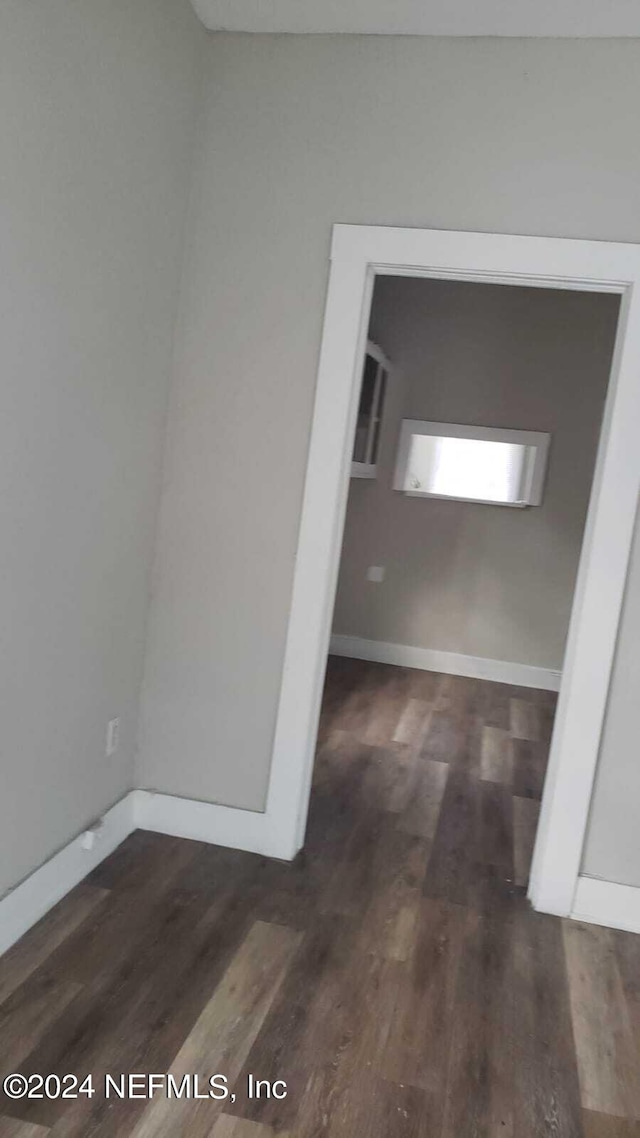 empty room featuring dark hardwood / wood-style floors