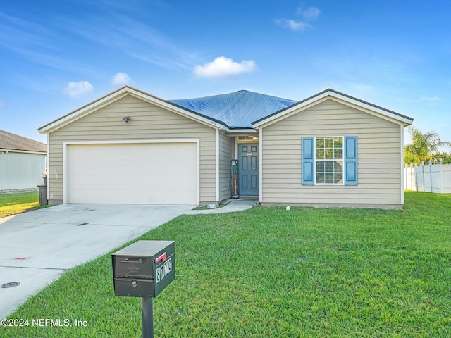 ranch-style home with a front yard and a garage