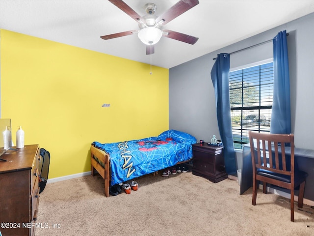 bedroom with ceiling fan and light colored carpet