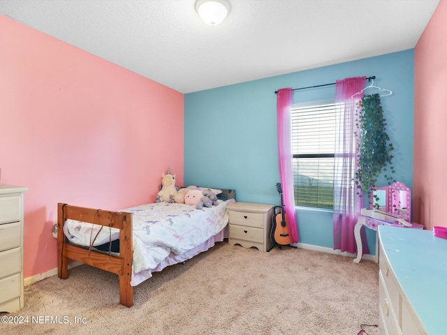 bedroom featuring light colored carpet