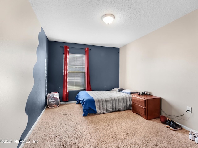 carpeted bedroom with a textured ceiling