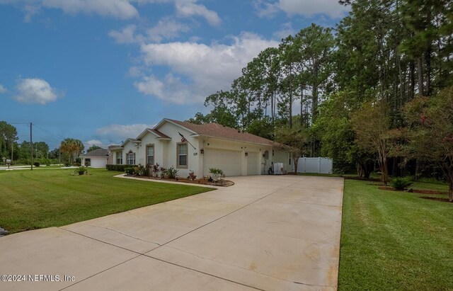 view of front of house featuring a front lawn and a garage