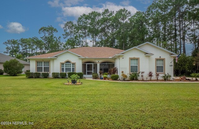 ranch-style home with a front yard