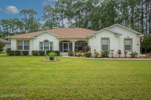 ranch-style home with a front yard