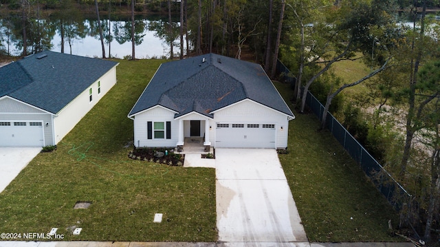 view of front of home with a water view and a front yard