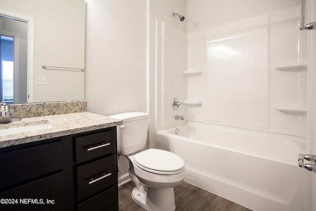 full bathroom featuring shower / tub combination, hardwood / wood-style floors, vanity, and toilet