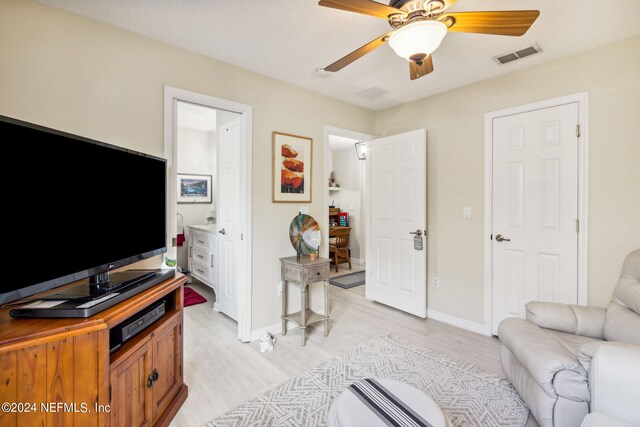 interior space with light wood-type flooring and ceiling fan