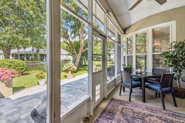 sunroom featuring ceiling fan