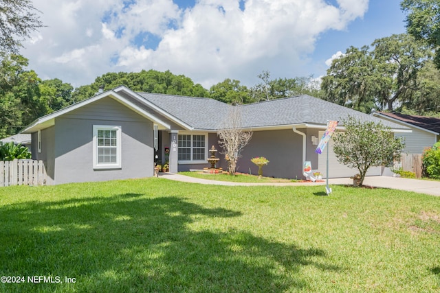 single story home with a garage and a front yard