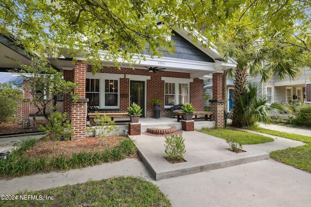 view of front of property with ceiling fan and a porch