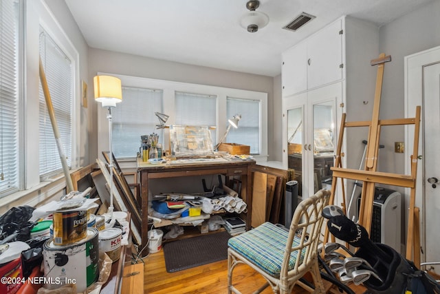 miscellaneous room with light wood-type flooring and french doors