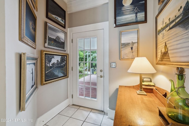 doorway to outside with light tile patterned floors