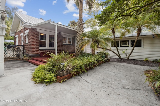 view of front of property with a patio and a deck