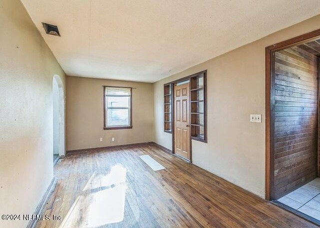 unfurnished room featuring light hardwood / wood-style floors