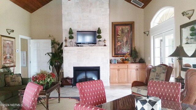 tiled living room with high vaulted ceiling