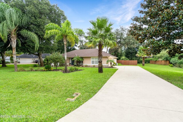 ranch-style home with a front yard