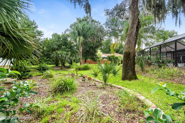 view of yard featuring a lanai