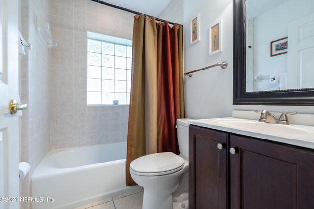 full bathroom featuring vanity, tile patterned flooring, toilet, and shower / bathtub combination with curtain