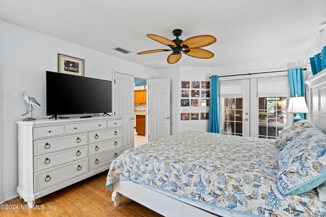 bedroom featuring french doors, ceiling fan, light hardwood / wood-style floors, and access to outside