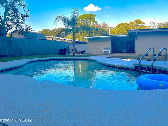 view of swimming pool featuring a patio