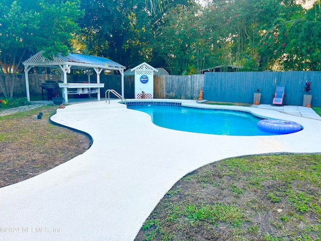 view of swimming pool featuring a patio and a gazebo