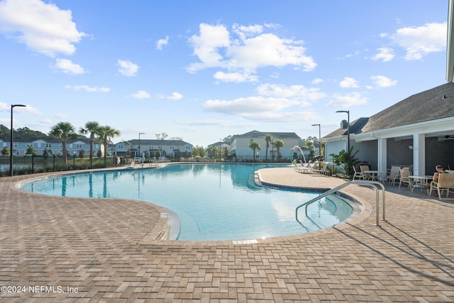 view of pool featuring a patio area