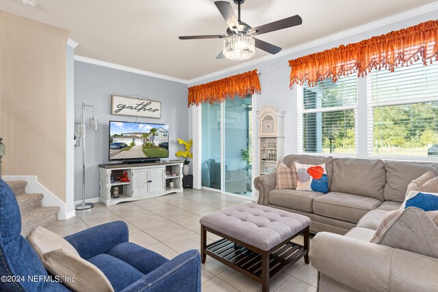 tiled living room featuring crown molding and ceiling fan