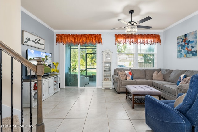 tiled living room featuring ornamental molding, ceiling fan, and a healthy amount of sunlight