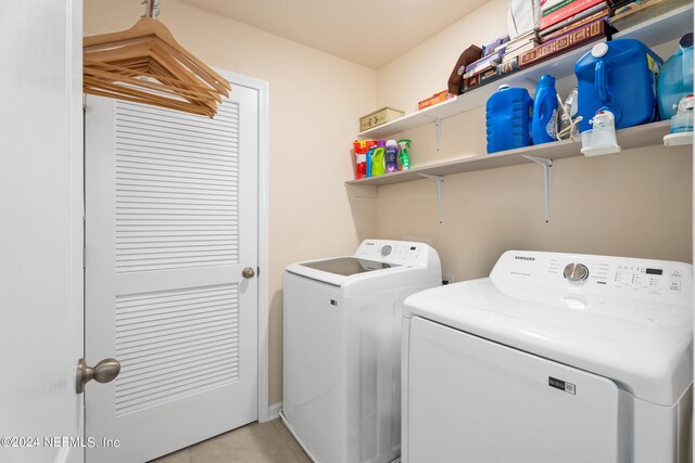 laundry area with independent washer and dryer