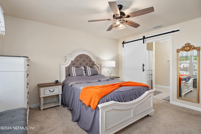 bedroom with ceiling fan and light colored carpet