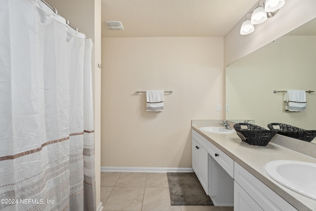 bathroom featuring vanity, tile patterned flooring, and a shower with shower curtain