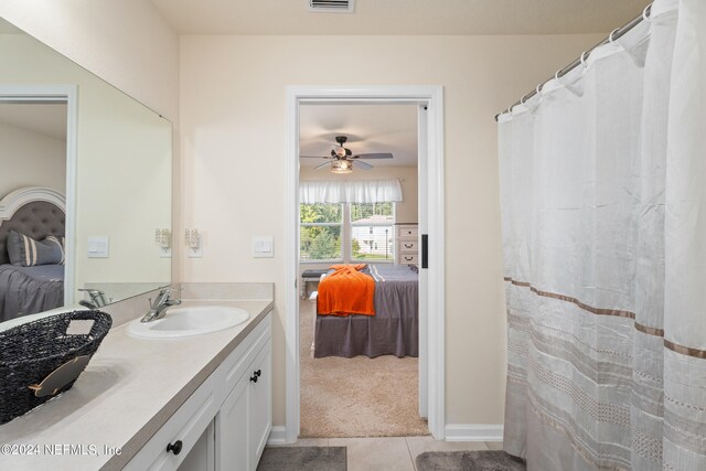 bathroom featuring tile patterned floors, ceiling fan, and vanity