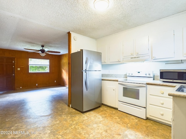 kitchen featuring a textured ceiling, appliances with stainless steel finishes, ceiling fan, light countertops, and under cabinet range hood