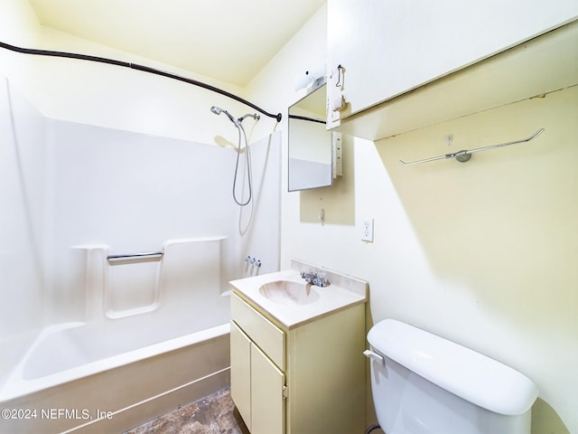 bathroom with tub / shower combination, toilet, and vanity