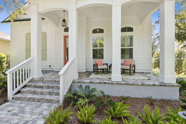 doorway to property with a porch