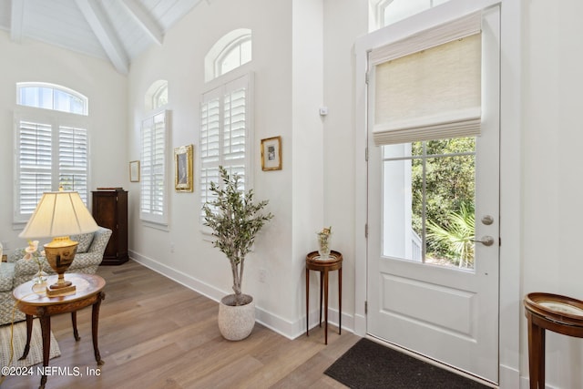 1505 Lakeside Ct, Fernandina Beach, FL 32034 - foyer entrance featuring vaulted ceiling with beams, baseboards, and wood finished floors