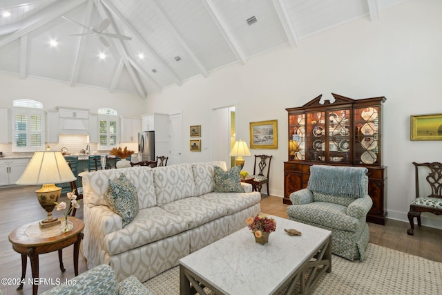 1505 Lakeside Ct, Fernandina Beach, FL 32034 - living area featuring high vaulted ceiling, light wood finished floors, baseboards, visible vents, and ceiling fan