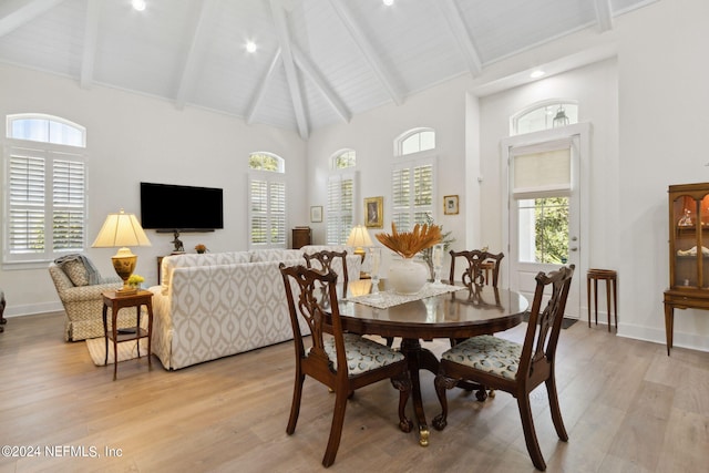 1505 Lakeside Ct, Fernandina Beach, FL 32034 - dining room with baseboards, high vaulted ceiling, and light wood-style flooring