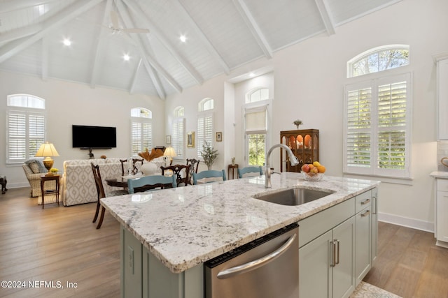 1505 Lakeside Ct, Fernandina Beach, FL 32034 - kitchen with stainless steel dishwasher, light wood-type flooring, a center island with sink, and a sink