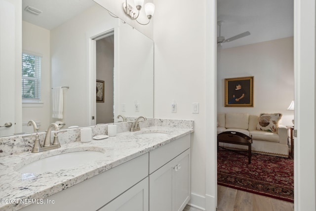 1505 Lakeside Ct, Fernandina Beach, FL 32034 - full bath featuring double vanity, a sink, connected bathroom, and wood finished floors