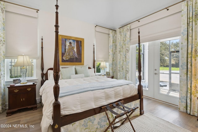 1505 Lakeside Ct, Fernandina Beach, FL 32034 - bedroom with multiple windows, access to outside, and wood finished floors