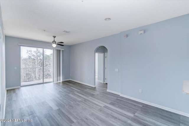 unfurnished room featuring ceiling fan and hardwood / wood-style flooring