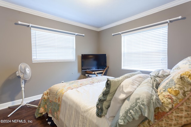 bedroom featuring dark hardwood / wood-style floors and ornamental molding