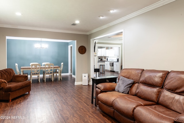 living room with dark hardwood / wood-style floors and ornamental molding